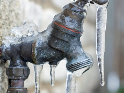 image of a frozen outdoor faucet