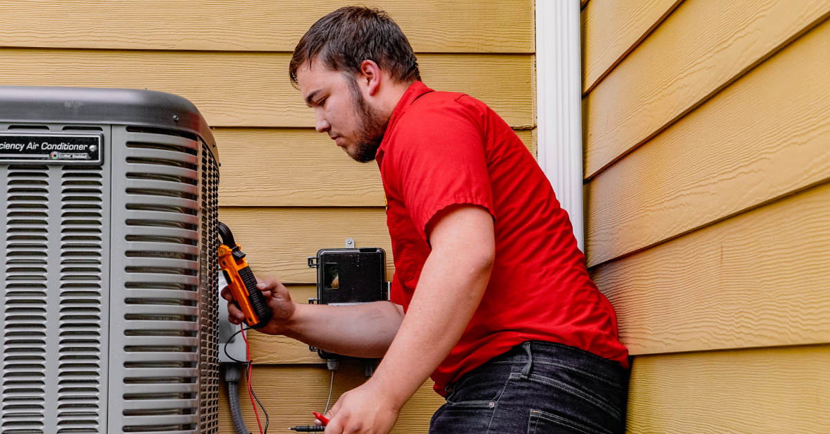 Technician working on an AC