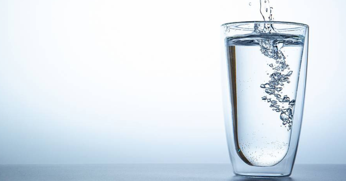 Pouring water into a glass