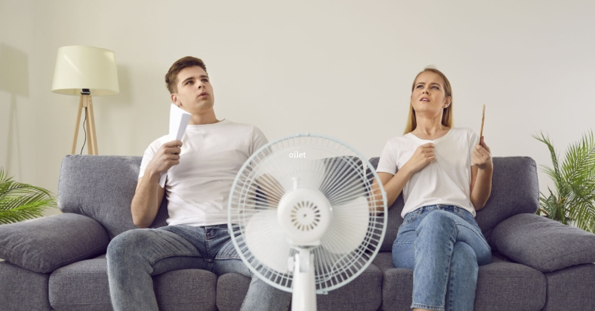 sitting in front of fan