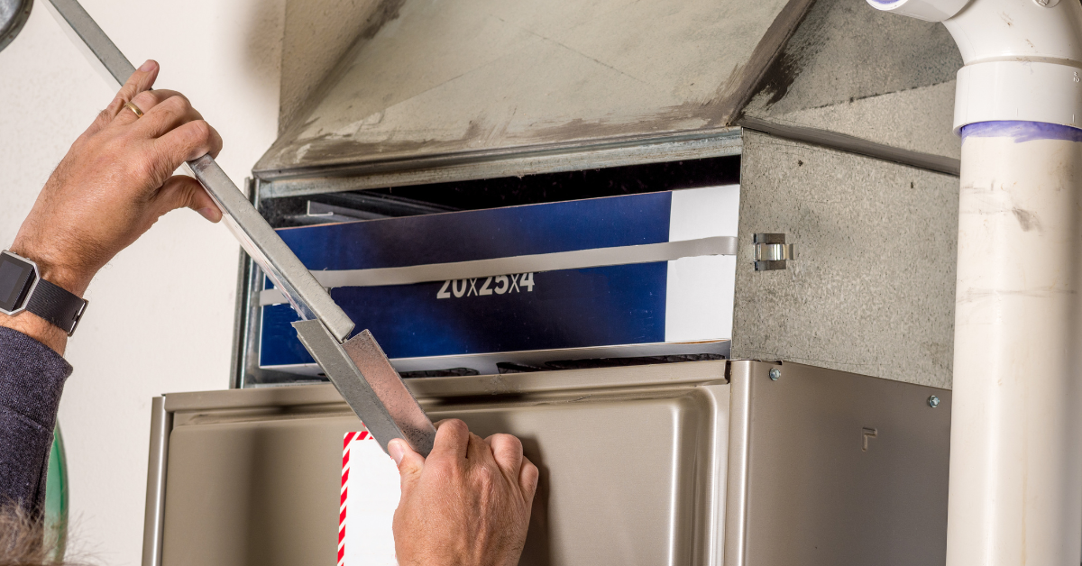 image of someone changing a furnace filter